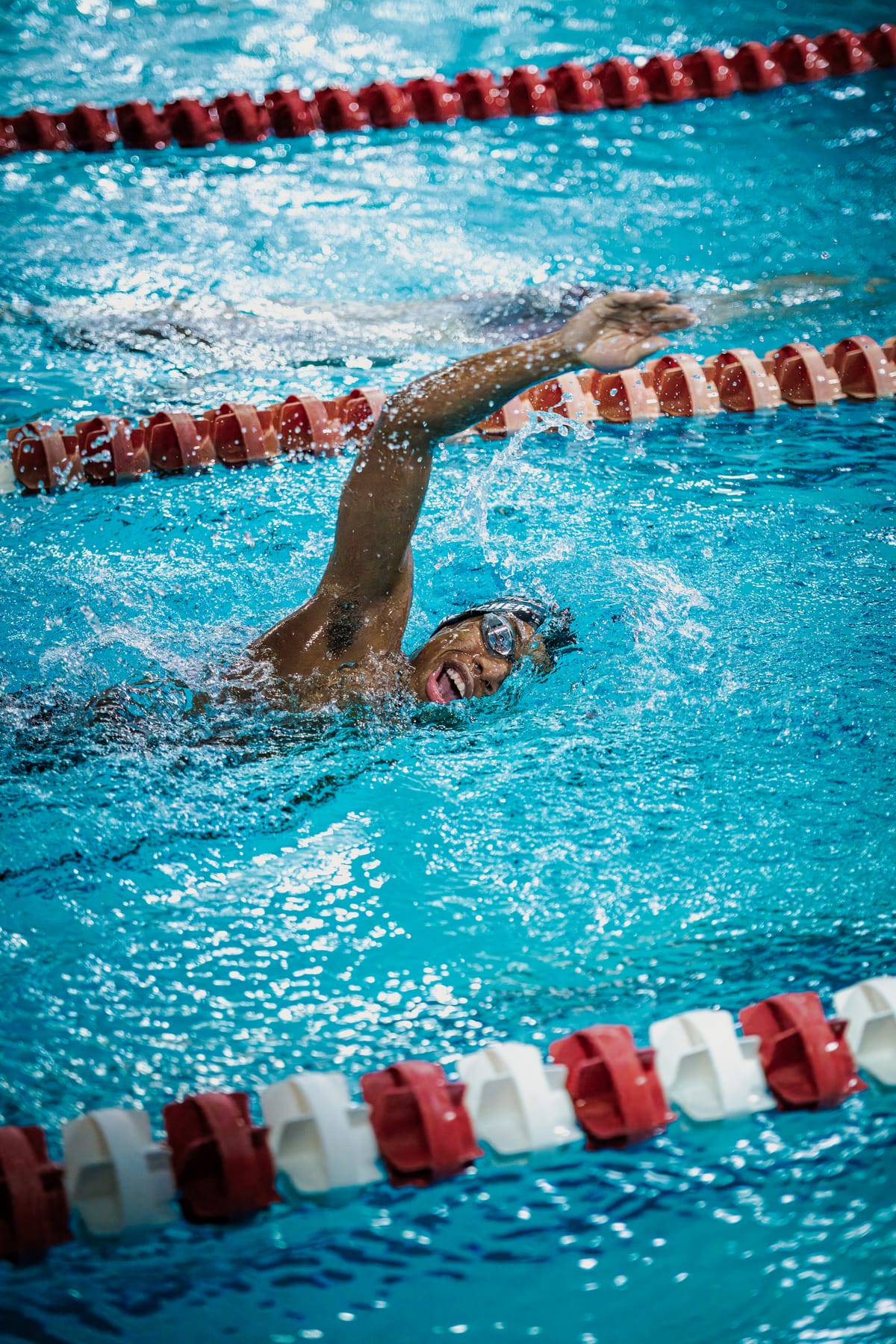 Swimmer mid-stroke during a freestyle lap
